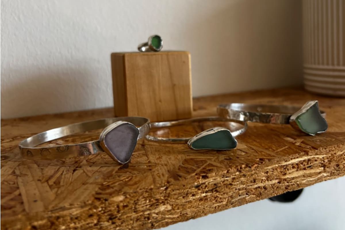 three sea glass bangles on a shelf