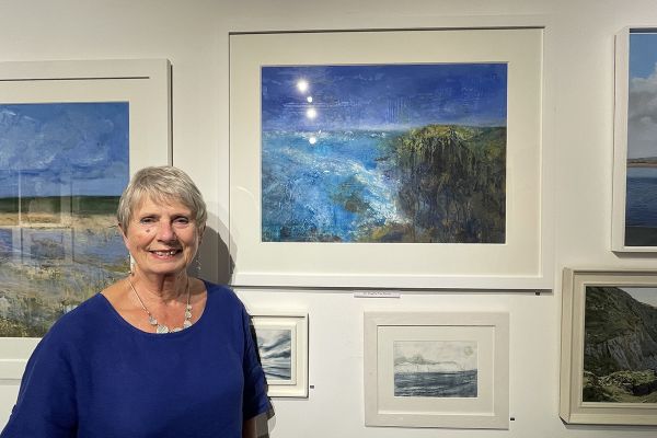 Artist Jenny Smy with her picture 'Headland II'