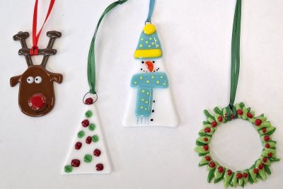 four fused glass Christmas decorations